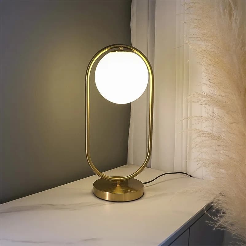 Đèn ngủ để bàn khung vòng oval vàng đồng cầu trắng sữa KH-DB168 Đèn ngủ để bàn khung vòng oval vàng đồng cầu trắng sữa KH-DB168